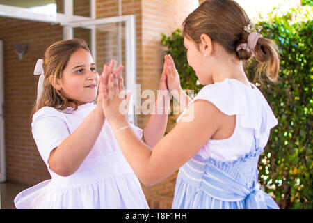 Murcia, Spain, May 12, 2019: Birthday party with friends. Little girls celebrate special communion date. Child, children, kid, kids playing together. Stock Photo