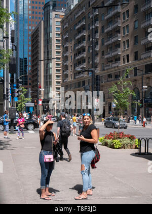 Downtown Montreal is a busy hub of shoppers, office workers, tourists and students. Stock Photo
