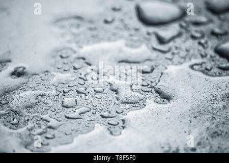 Water droplets on metal background. Raindrops on steel surface. Stock Photo