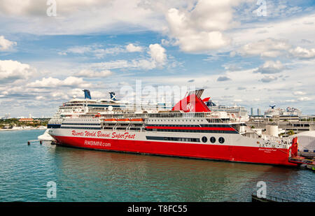 Miami, USA- January 1, 2016: World resorts bimini super fast cruise liner in sea port on cloudy sky background in Miami, USA. Ship tour and travelling. Summer vacation concept Stock Photo