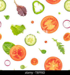Seamless pattern of fresh vegetables and salad leaves. Tomato, cucumber, onion pepper slices with mezclun on a white background, vegan repeat print Stock Photo