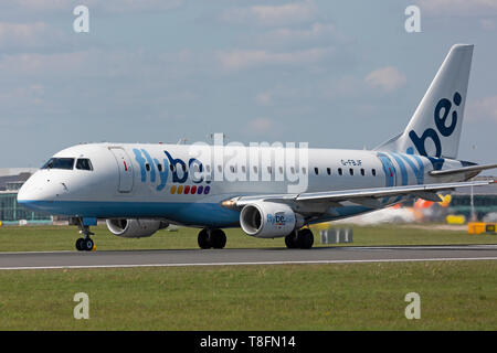 A Flybe Embraer ERJ-175 aircraft, registration G-FBJF, taking off from Manchester Airport, England. Stock Photo