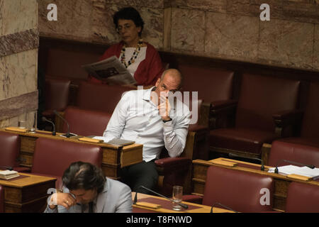 Athens, Greece. 14th Aug 2015. Former Minister of Finance Yanis Varourakis attends an overnight debate of the Greek Parliament on a new bailout agreement in Athens, Greece. Credit: Nicolas Koutsokostas/Alamy Stock Photo.. Stock Photo