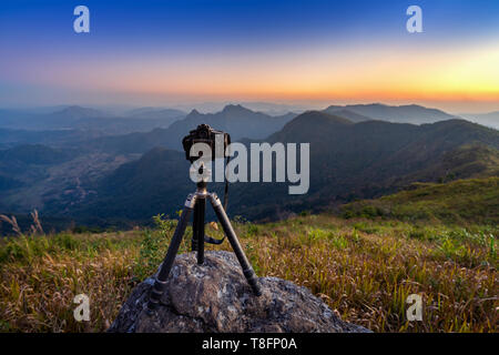 Digital camera on tripod in the mountains. Stock Photo