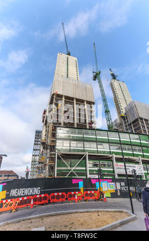 Woking, Surrey: construction of the new high rise mixed use Victoria Square development continues with concrete cores and tower cranes Stock Photo