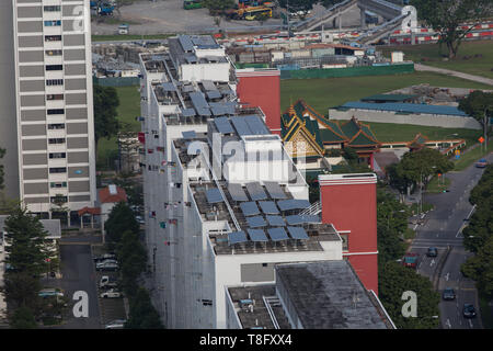 Aerial view of photovoltaic solar panels install on home building to absorb sunlight as a source of energy to generate electricity. Singapore. Stock Photo