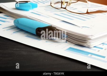Business analysis report with financial graphs on table. Stock Photo