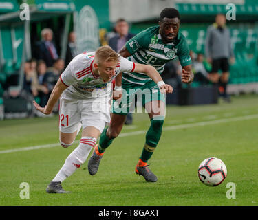 BUDAPEST, HUNGARY - JULY 12: (r-l) Roland Varga of Ferencvarosi TC hugs  goal scorer Stefan