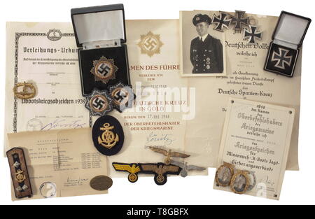 An estate of German Cross in Gold winner U-boat crew member Rudolf Zölk (U-123 'Hardegen') German Cross in Gold, maker Zimmermann, Pforzheim, light issue with four hollow rivets, the inside of the attachment pin punched '20', complete with the black award presentation case. Also, two cloth issue versions of the German Cross (of navy blue and grey cloth), three Iron Crosses 1st Class of 1939 (maker '20' in award case, maker '54' with threaded disc attachment and a piece (with rust film) without maker), a U-Boat War Badge (non-ferrous metal, gilt), two Minesweeper Badges (non, Editorial-Use-Only Stock Photo