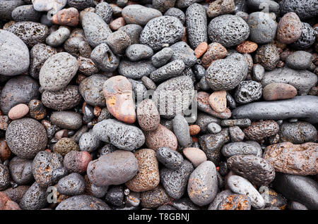 Natural background made of pebbles and volcanic rocks. Stock Photo