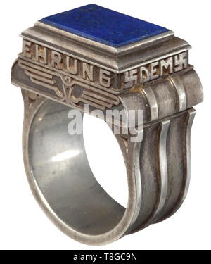 A Personal Gauleiter ring of Friedrich-Karl Florian Heavy, solid silver ring with the relief inscription 'Dem Kämpfer zur Ehrung' between swastikas around a lapis lazuli gem, behind it a national eagle (swastika in its claws not visible). Goldsmith work of high quality. With a brown paper packet bearing the typewritten inscription (tr.) 'Contents: 1 Gauleiter ring, personally received from Adolf Hitler, given during his visit to Düsseldorf in October 1937' and handwritten pencil note 'Für Ditha Fritz'. historic, historical, 20th century, 1930s, NS, National Socialism, Nazis, Editorial-Use-Only Stock Photo
