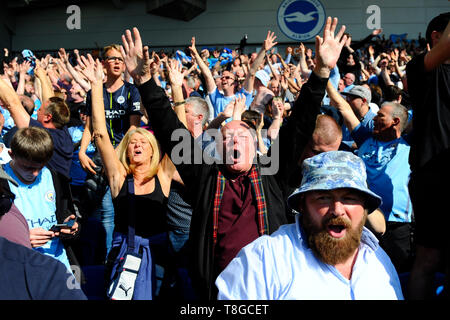 BRIGHTON, ENGLAND - MAY 12:     Fans celebrate their team winning the Premier League during the Premier League match between Brighton & Hove Albion and Manchester City at American Express Community Stadium on May 12, 2019 in Brighton, United Kingdom. (MB Media) Stock Photo