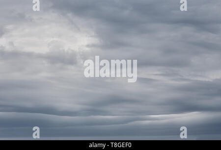 Sky background with dramatic dark clouds. Sky texture photo with storm clouds Stock Photo
