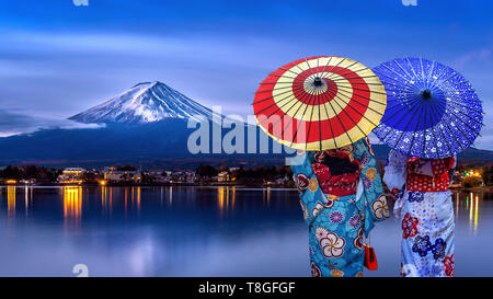 Asian womans wearing japanese traditional kimono at Fuji mountain, Kawaguchiko lake in Japan. Stock Photo