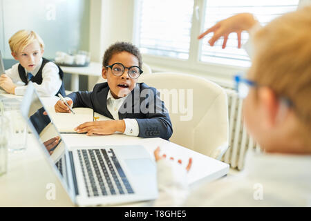 Children as students or business people in class or a computer course Stock Photo