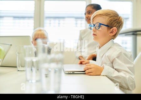 Children as pupils or students in a computer course in school or university Stock Photo