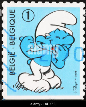 Cartoon smurf laughing on belgian postage stamp Stock Photo