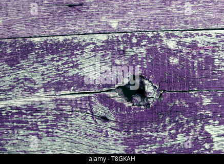 old blue board with cracked paint, vintage wood background, grunge plank. Old wooden background with remains of pieces of scraps of old paint on wood. Stock Photo