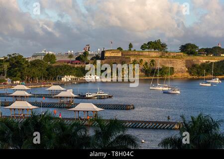 Martinique, Caribbean Sea, Bay of Fort de France, Flemish Bay at sunrise overlooking the pontoons, Fort Saint-Louis, La Savane and in the background a liner at the pier Stock Photo