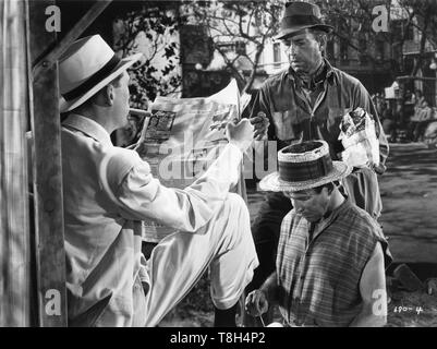 Humphrey Bogart as Fred C. Dobbs John Huston as American in Tampico THE TREASURE OF THE SIERRA MADRE 1948 director / screenplay John Huston novel B.Traven Warner Bros. Stock Photo