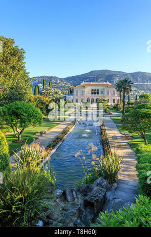 France, Alpes Maritimes, Saint Jean Cap Ferrat, villa and gardens Ephrussi de Rothschild, the French garden, large pond and water jets and view on the Stock Photo