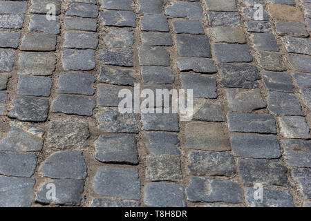 Paving old cobble tiles texture background. Copy space Stock Photo