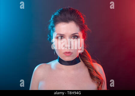 Make up, model, fashion and people concept - portrait of woman in gothic style is looking very serious Stock Photo