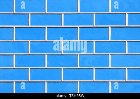 Brick wall background - new bricks wall pattern. Texture brick wall of bright blue color Stock Photo