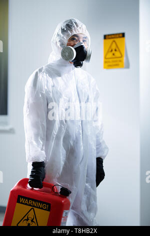 Laboratory worker in biohazard suit Stock Photo
