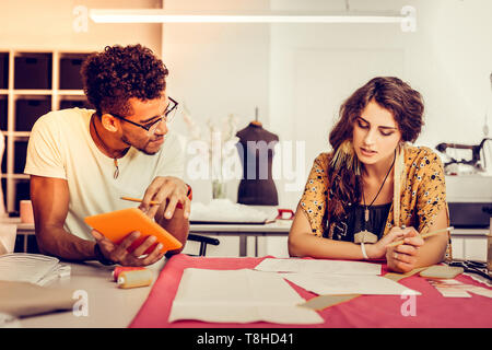 Young designers working together in a workshop. Stock Photo