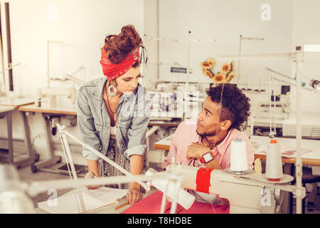 Colleagues discussing subtle aspects of their design. Stock Photo