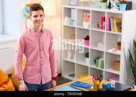 Smiling student feeling excited before studying and doing homework Stock Photo