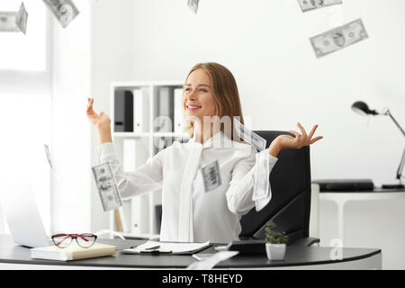 Successful businesswoman with lot of money in office Stock Photo