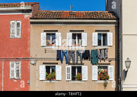 Laundry hanging to dry outside an old house in Grado, Friuli Venezia Giulia, Italy Stock Photo