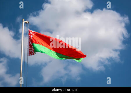 Belarusian flag against blue sky Stock Photo