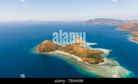 Tropical islands of the Malay Archipelago. Many islands with turquoise lagoons and coral reefs aerial view. Philippines, Palawan Stock Photo