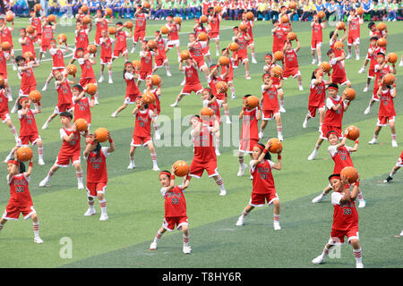 Beijing, China. 12th May, 2019. Students take part in a sports meeting at Yueyangdao Primary School in Heping District of Tianjin, north China, May 12, 2019. More than 2,000 students participated in the school sports meeting on Sunday. Credit: Liu Dongyue/Xinhua/Alamy Live News Stock Photo