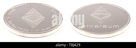 Golden ethereum isolated on white background. Front and back sides are shown. High resolution photo. With clipping path. Full depth of field. Stock Photo