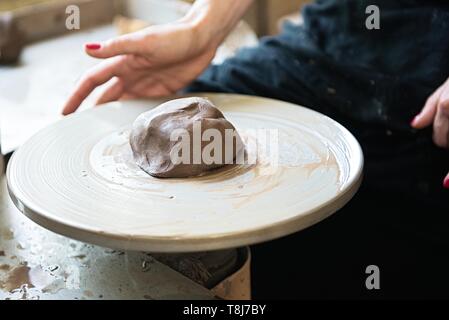 A lace maker and ceramicist create artwork. Hands top view Stock Photo