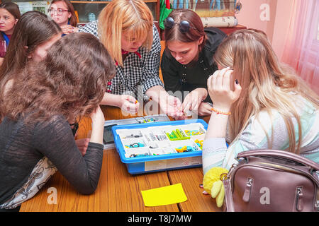 Chapaevsk, Samara region, Russia - April 17, 2019: College in Chapaevsk city. Robotics lesson with a set of Lego. Students design machine robots using Stock Photo