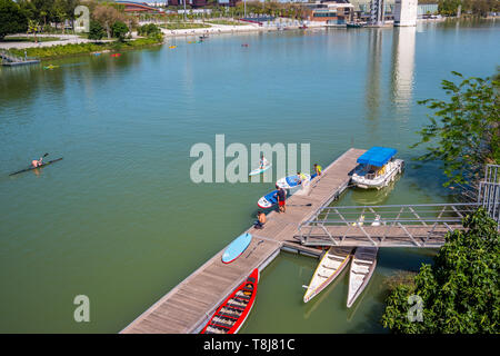 SEVILLE, SPAIN May 8th 2019 Rowers along the Guadalquivir river, Seville, Stock Photo