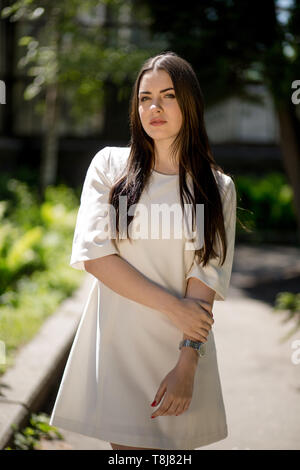 Beautiful smiling woman in summer park Stock Photo