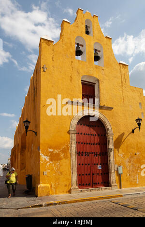 Campeche Mexico; San Francisquito church, brightly coloured yellow building in Campeche old town, Mexico Latin America; travel Stock Photo