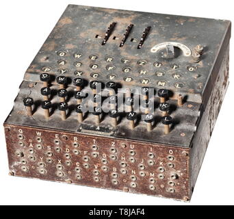A German cypher machine 'Enigma I', Luftwaffe issue, 1944, model no. '20057', manufacturer 'jla' (Cypher Machine Company Heimsoeth und Rinke, Berlin) Three scrambling rotors with the numeric keys 1 to 26, the aluminium rotor assembly each with matching numbers 'A 20057'. In a light alloy box lacquered in field-grey with the handwritten number '20057' on the underside. The hinged lid with keyboard, power switch, and screw type terminals for external power supply. Partly functioning keyboard (two keys missing), plugboard at the front. Size 26 x 29 x ca. 13 cm. Untouched find , Editorial-Use-Only Stock Photo