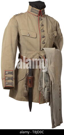 A uniform ensemble for an Oberleutnant of the Bavarian flying corps in the German mountain unit Light, unlined field tunic of reed-green cloth with red piping, patinated lion's head buttons, woven silver trim and sewn-on shoulder boards of the Infantry Lifeguards Regiment, unlined and with additional propeller appliqués, three pairs of orders loops. The breeches of stone-grey canvas, complete with white cotton lining and with remains of stampings. Brown double prong belt with frog, bayonet and officer's portepee. An obviously used, lightly faded ensemble of great rarity. hi, Editorial-Use-Only Stock Photo