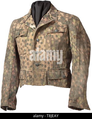 A field tunic M 43 for the camouflage suit of the Waffen-SS Made of imprinted pea pattern camouflage using confiscated Italian material (substantially rarer as fishbone drill cloth), inner reinforcement of imitation silk, field-grey buttons. A shortened field tunic with obvious signs of age and use. historic, historical, 20th century, 1930s, 1940s, Waffen-SS, armed division of the SS, armed service, armed services, NS, National Socialism, Nazism, Third Reich, German Reich, Germany, military, militaria, utensil, piece of equipment, utensils, object, objects, stills, clipping, Editorial-Use-Only Stock Photo