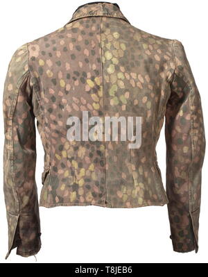 A field tunic M 43 for the camouflage suit of the Waffen-SS Made of imprinted pea pattern camouflage using confiscated Italian material (substantially rarer as fishbone drill cloth), inner reinforcement of imitation silk, field-grey buttons. A shortened field tunic with obvious signs of age and use. historic, historical, 20th century, 1930s, 1940s, Waffen-SS, armed division of the SS, armed service, armed services, NS, National Socialism, Nazism, Third Reich, German Reich, Germany, military, militaria, utensil, piece of equipment, utensils, object, objects, stills, clipping, Editorial-Use-Only Stock Photo