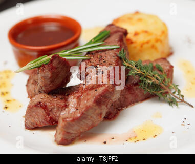 Grilled beef ribs on plate - pub food Stock Photo