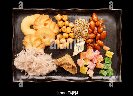 Oriental sweets on plate shot from above isolated with clipping path Stock Photo