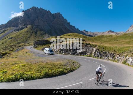 France, Savoie, Valloire, massif des Cerces, cycling ascension of the Col du Galibier, one of the routes of the largest bike domain in the world, camper and cyclists share the road in front of the Grand Galibier Stock Photo